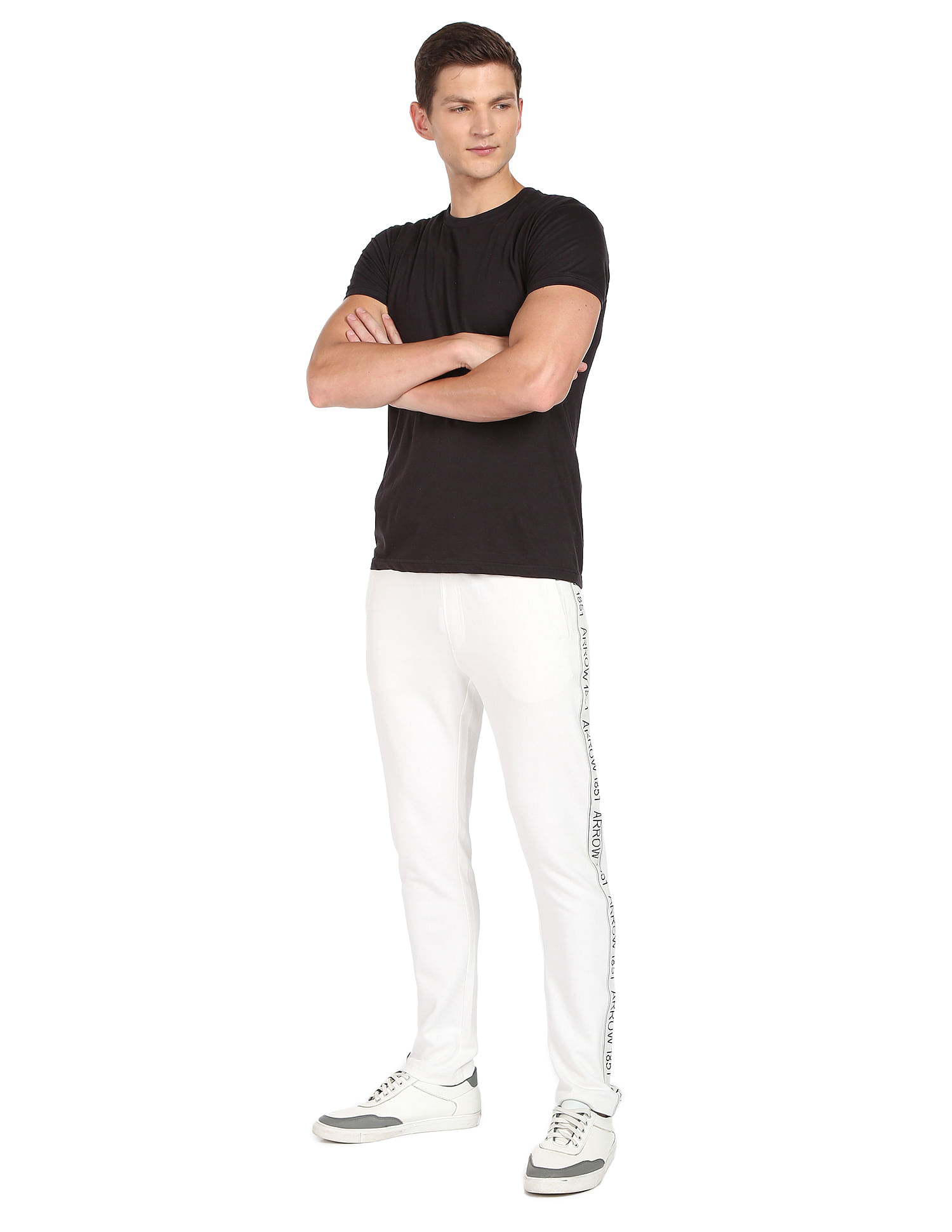 Buy Arrow Men White Mid Rise Brand Embossed Solid Track Pants - NNNOW.com