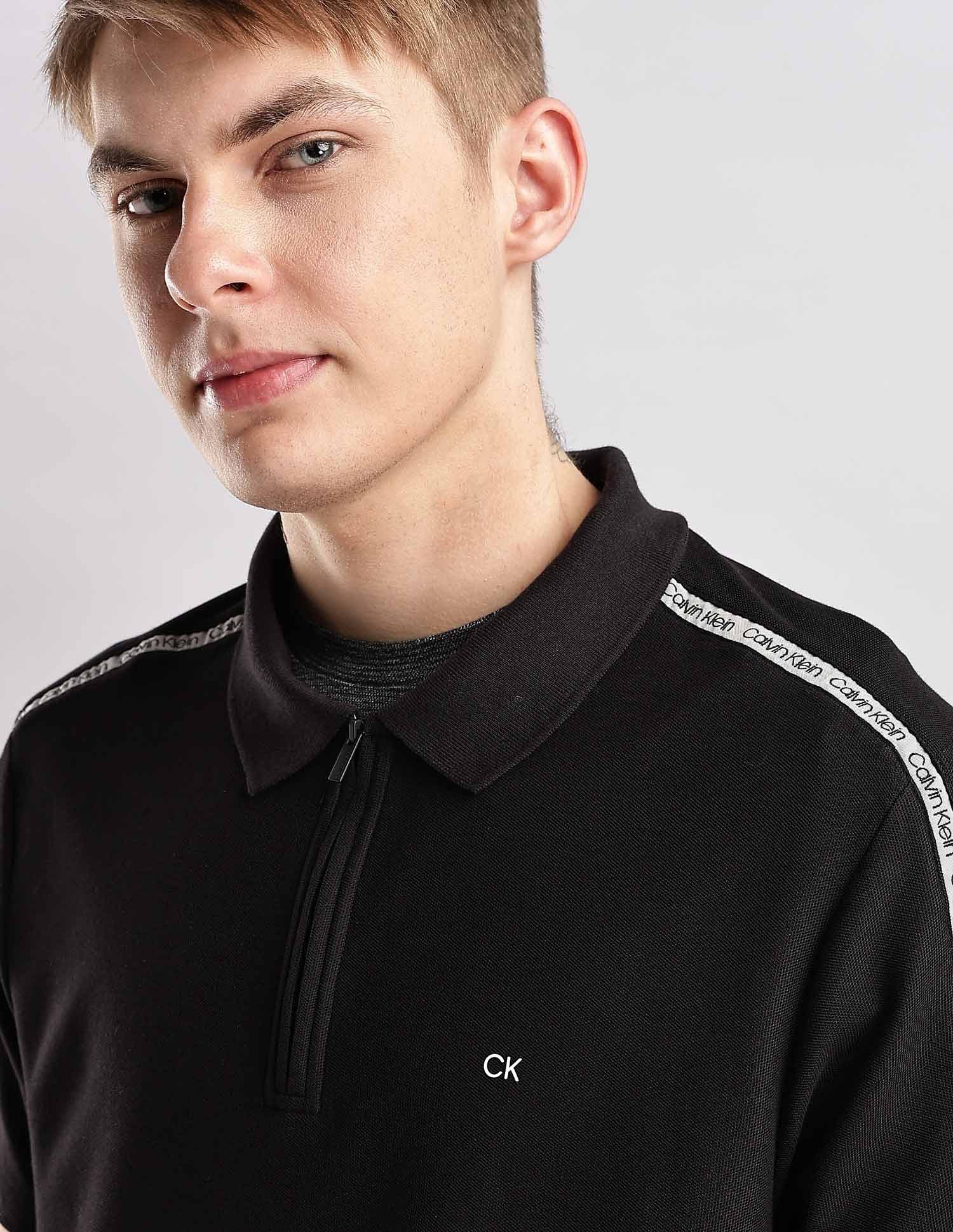 Calvin Klein Jeans Mens Black Solid Polo Shirts