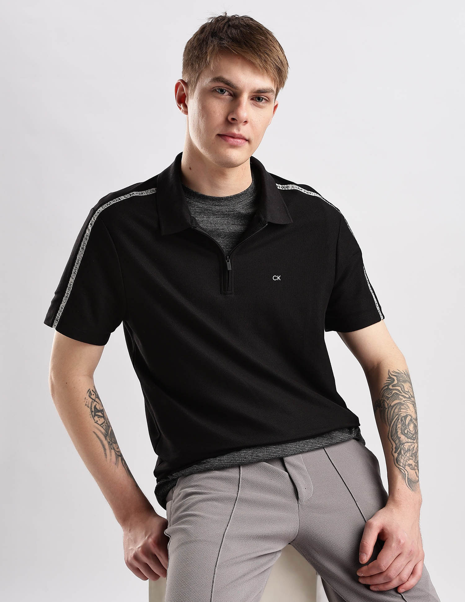 Calvin Klein Jeans Mens Black Solid Polo Shirts