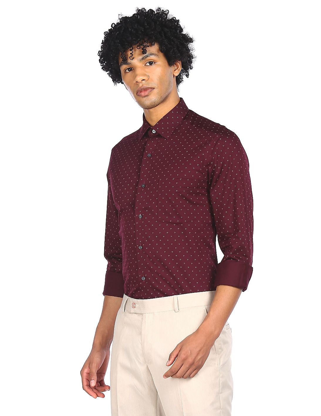 maroon shirt with white buttons