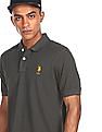 U.S. Polo Assn. Ribbed Collar Solid Polo Shirt