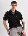 Calvin Klein Jeans Mens Black Solid Polo Shirts